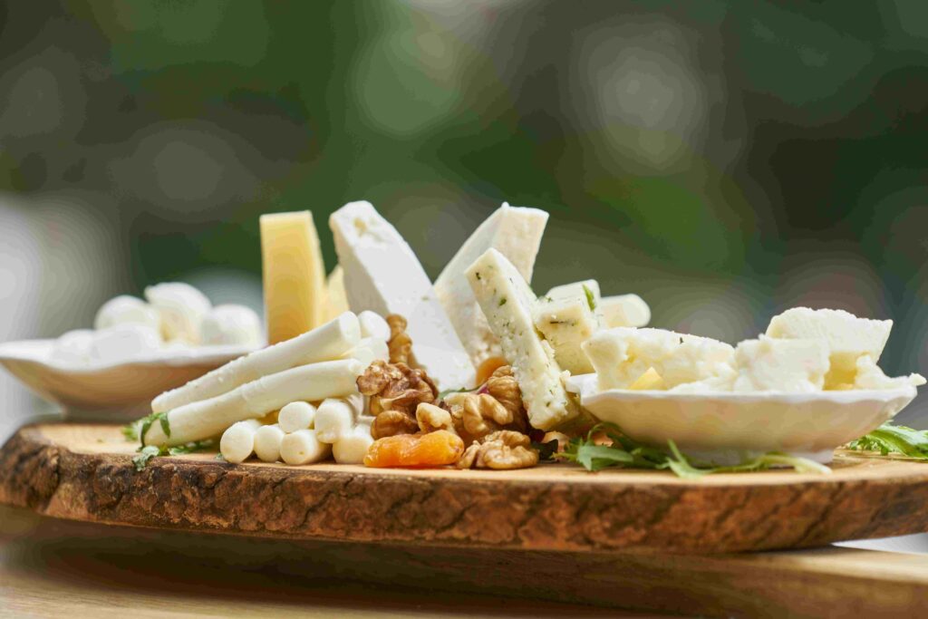 FULL FAT DAIRY PRODUCTS PLACED ON WOODEN DISH