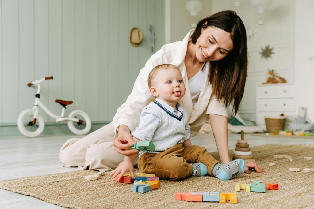 mom and her baby playing with toys