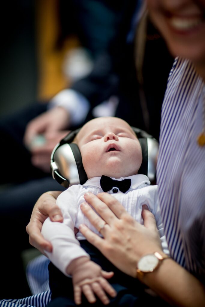 A small baby listening music